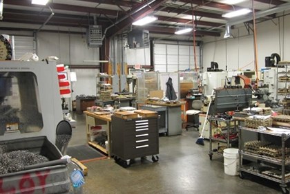 Shop floor with machines, workbenches and tool carts